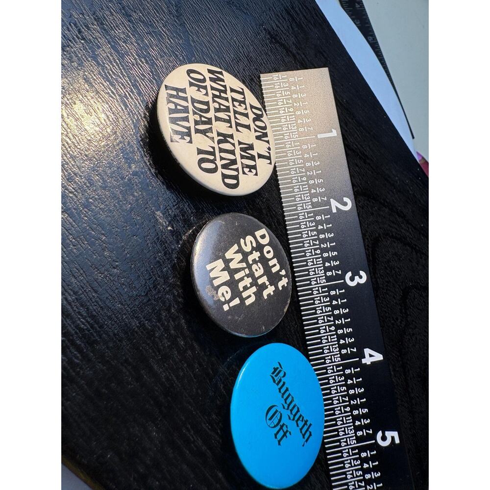 Three Vintage pins or buttons with sassy messages.